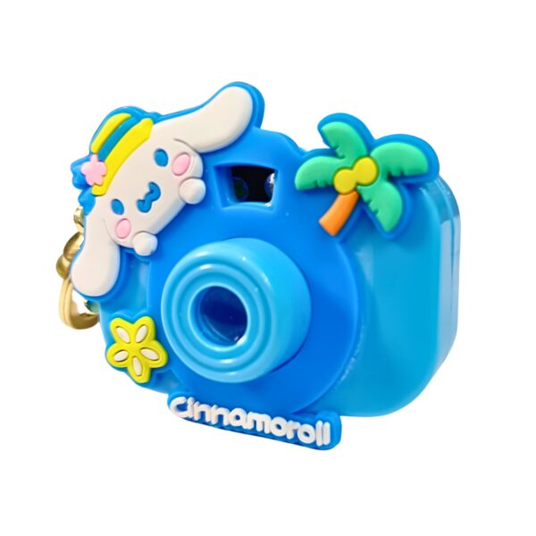 Adorable blue toy camera keychain featuring cinnamoroll and coconut tree.