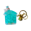 A delightful blue liquid-filled house keychain with floating beads, featuring a small bunny figure with a blue bow, attached to a gold keyring and a small bell.