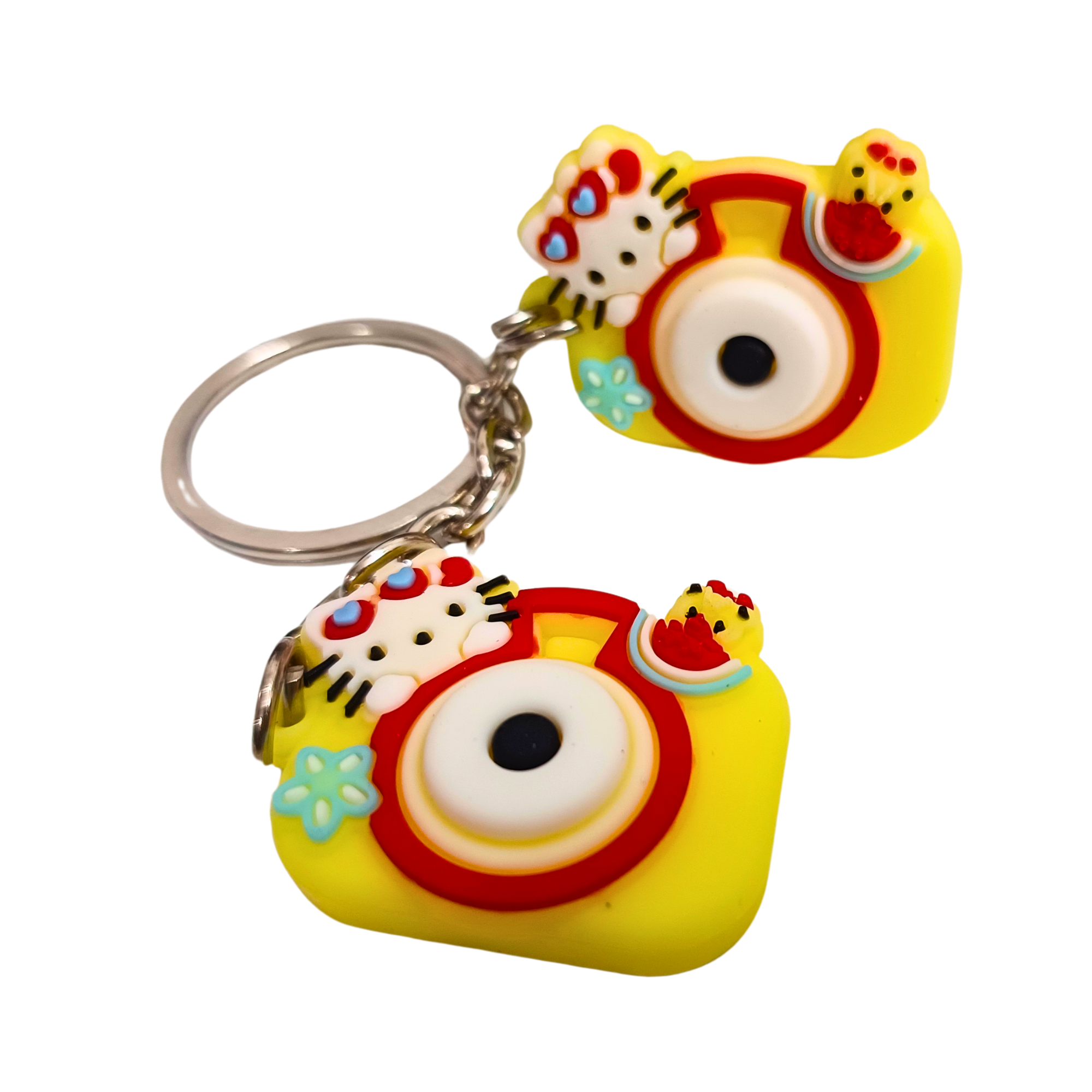 hello-kitty-camera-keychain-yellow-1 Yellow double camera keychain featuring Hello Kitty decorations with floral and fruit accents.