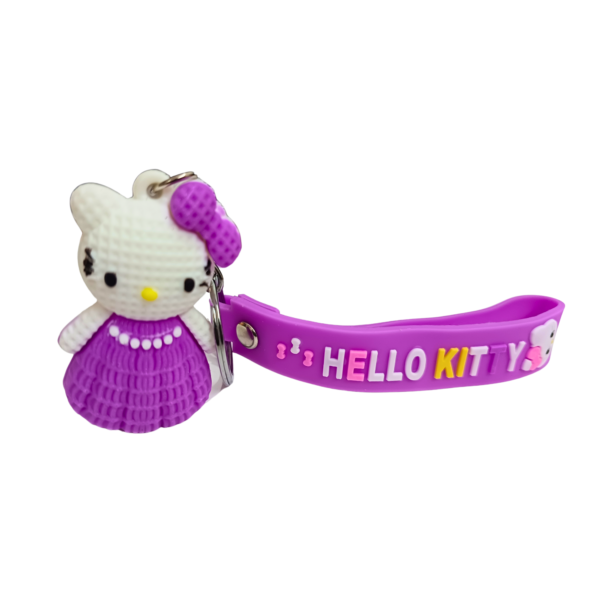 Hello Kitty keychain with a purple dress and a matching purple silicone strap.