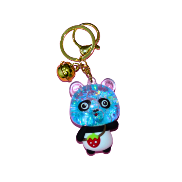 A blue glowing panda keychain with a glitter effect, featuring a gold keyring and a small golden bell charm.