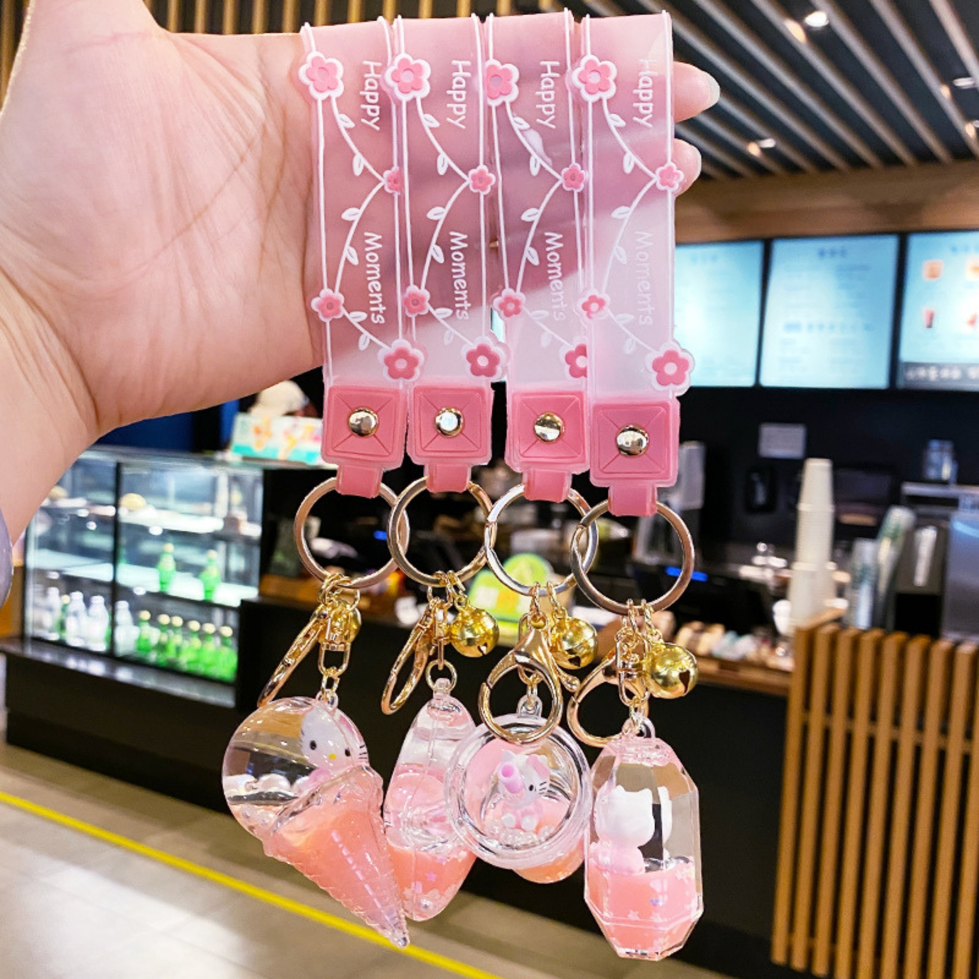 complete pink water glitter keychain set with hello kitty charms including star lollipop sipper ice cream and round models